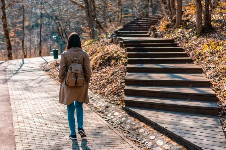 woman facing two paths