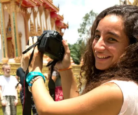 Volunteer taking a photo of a temple