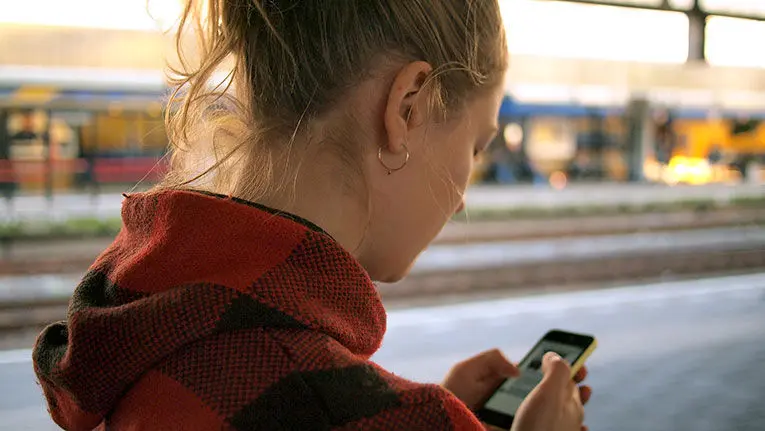 blond woman on smartphone