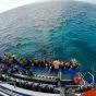 Divers preparing for ocean dive.