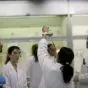 Group of Students holding a flask at a lab