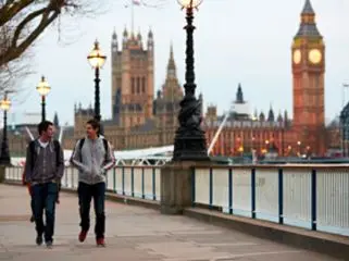 Two students strolling down a street in London