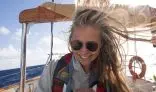 Seamester student at the helm