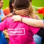 Students arms linked and T-Shirt reads  #study at UL 