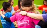 Students arms linked and T-Shirt reads  #study at UL 