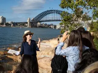 A teacher introducing the city of Sydney to her students