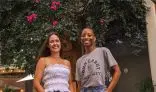 Two students smiling to the camera